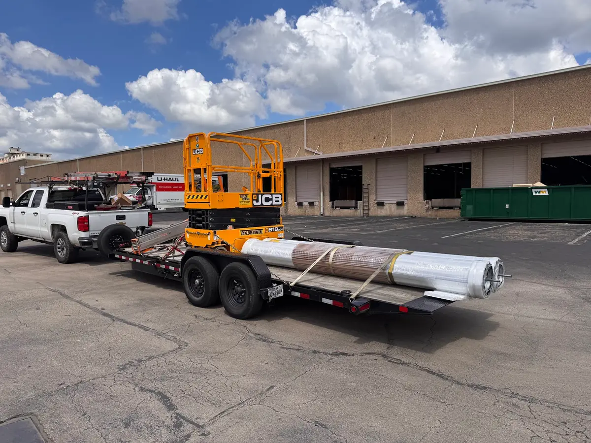 Truck and access equipment at a commercial overhead door project