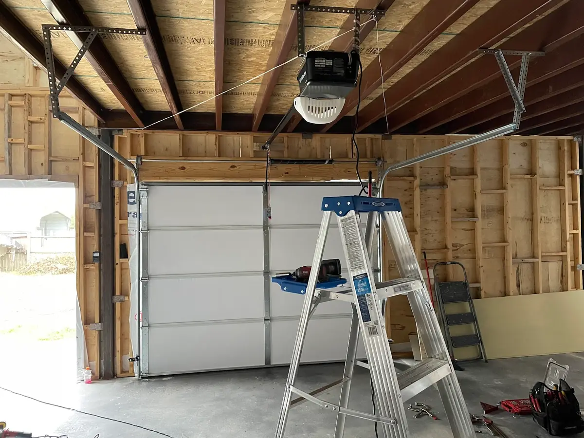 Garage door tracks and hardware inside a residential garage