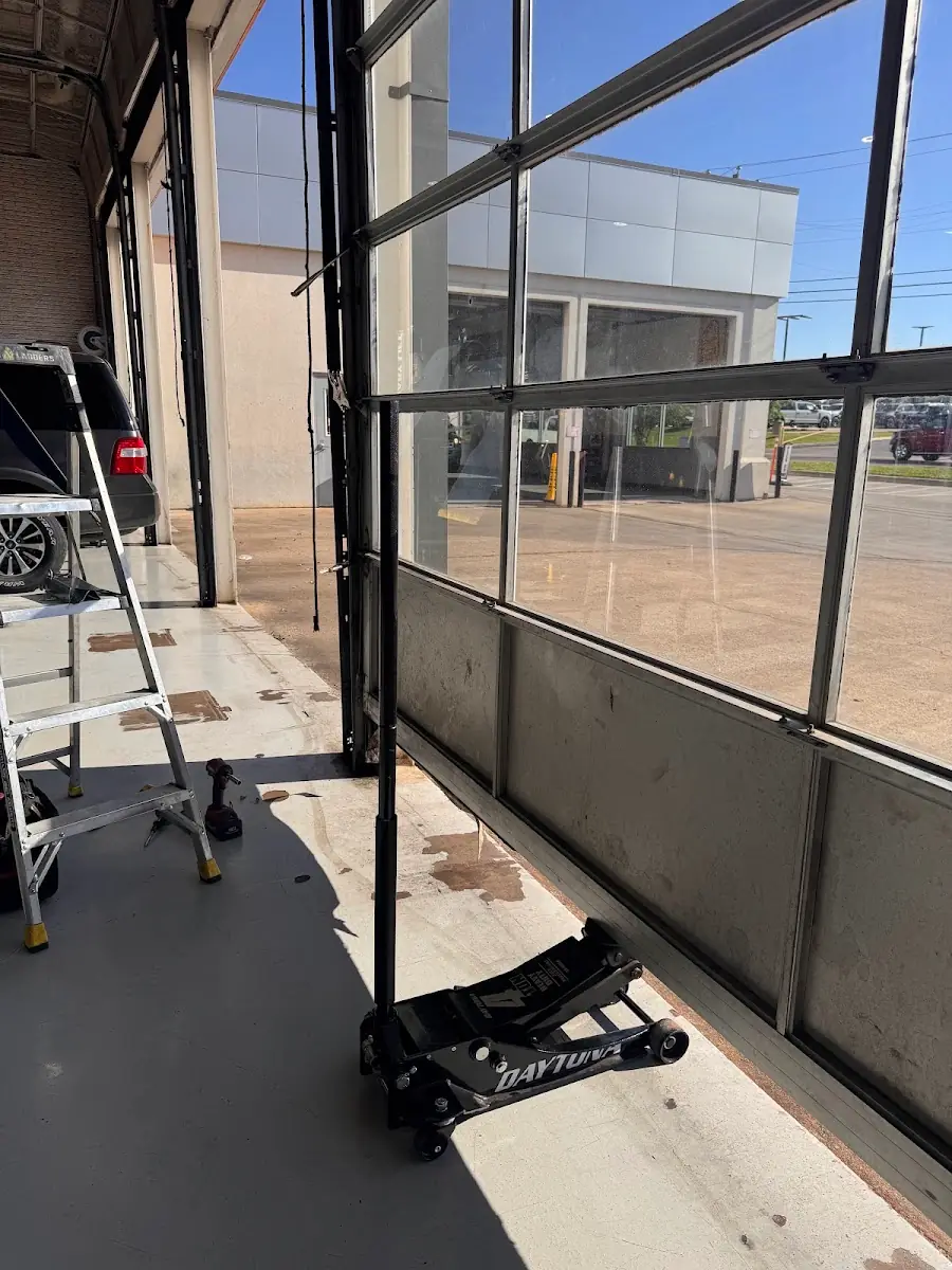 Interior tracks and hardware of a commercial glass overhead door