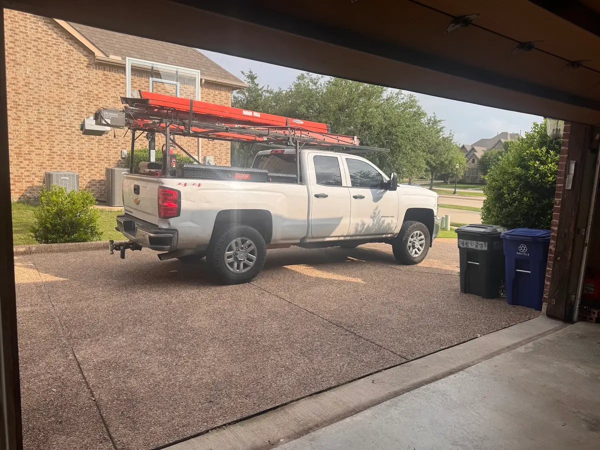 Service truck at a residential garage door appointment