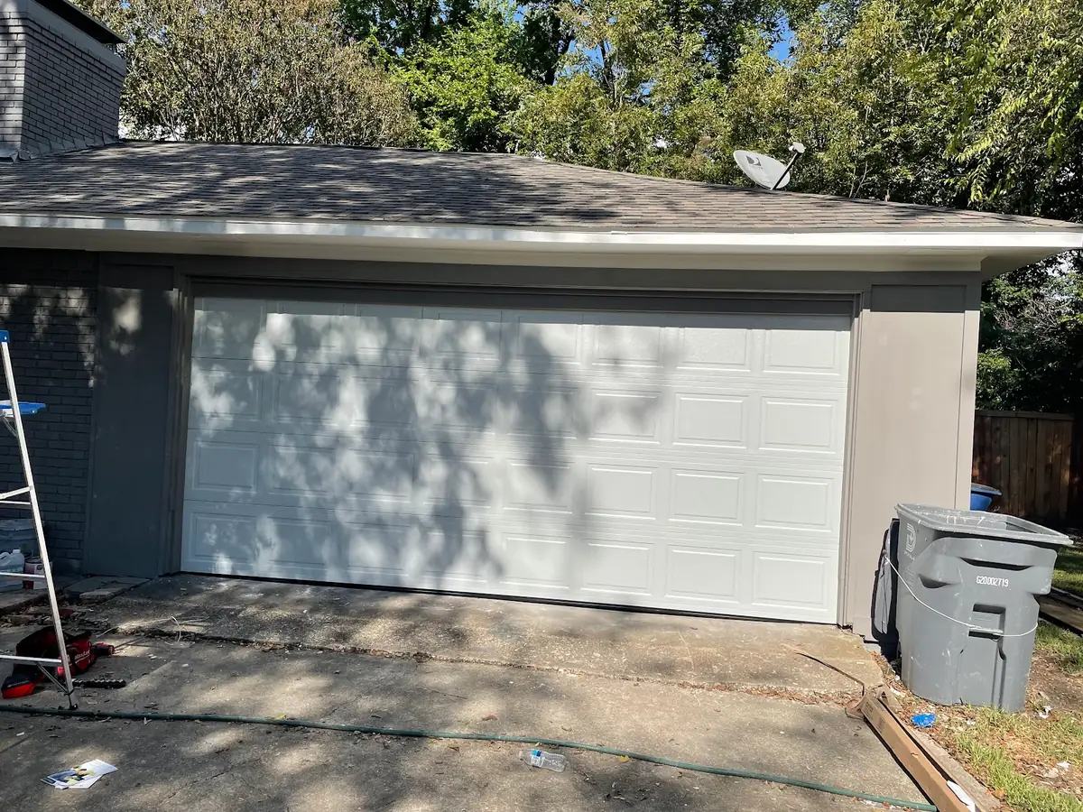 White raised-panel door on a residential garage